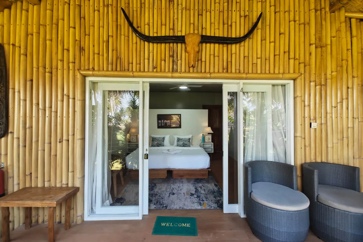 Villa Empat, bamboo terrace and entrance with buffalo horns
